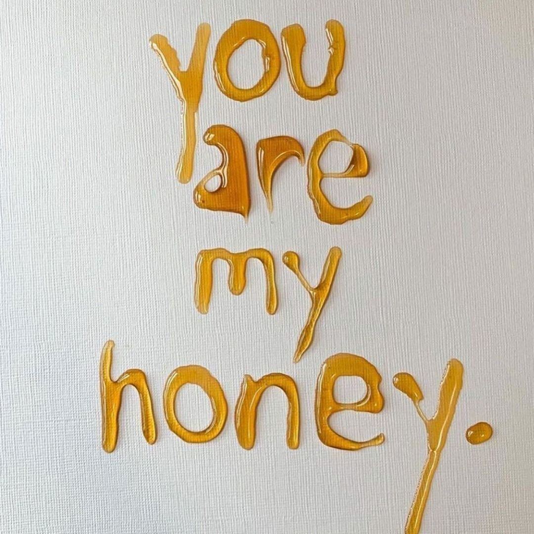 The words 'you are my honey' written in honey