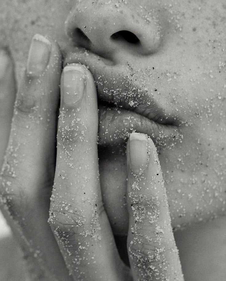 Sand dusted across sun-warmed skin